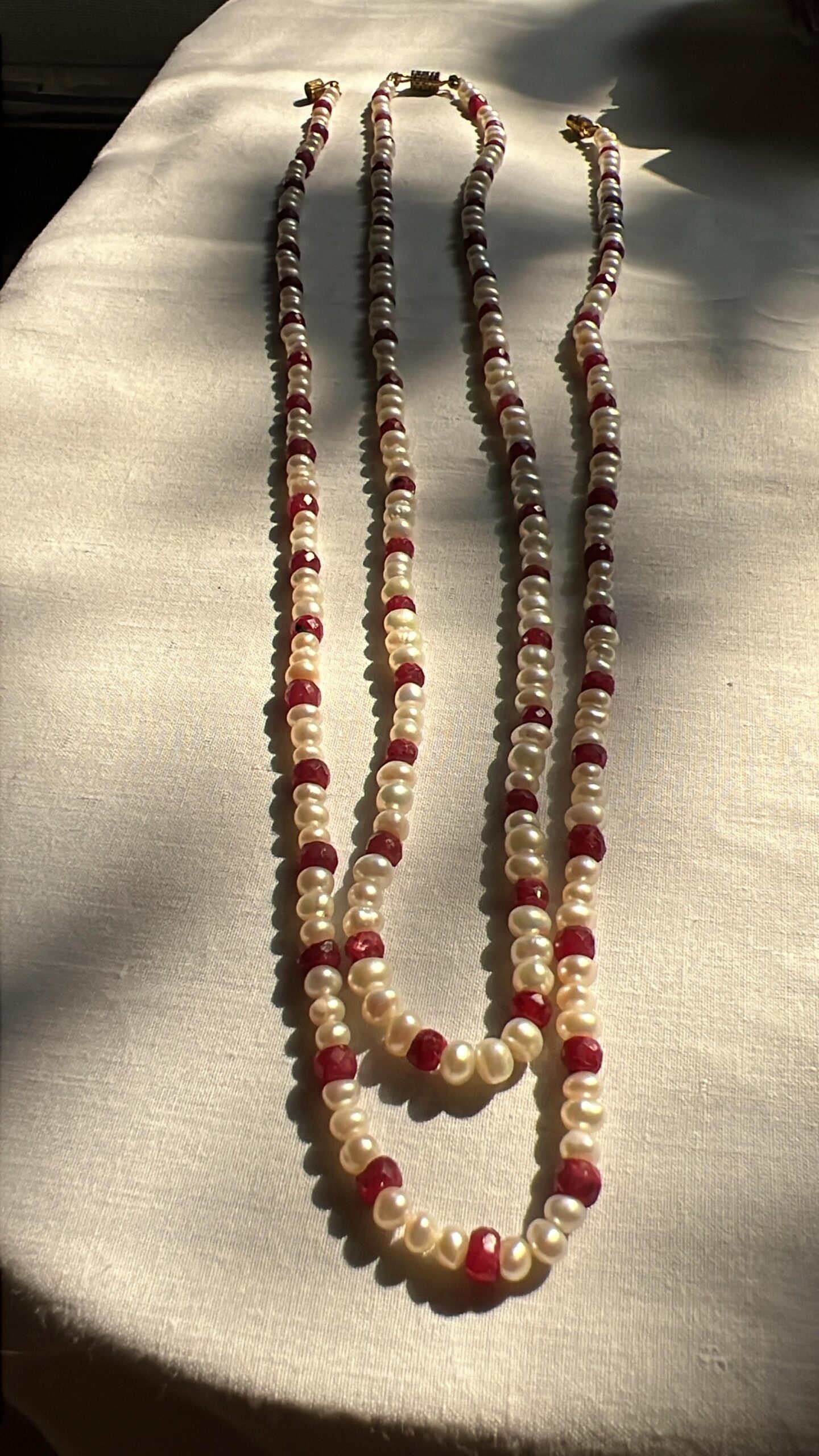 Elegant Ruby and Pearl Symphony Necklace